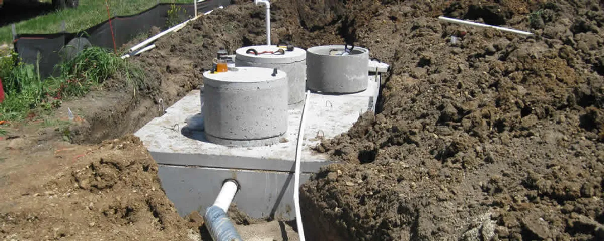 Septic system repair and installation site with tank access ports in Grand Rapids, MI